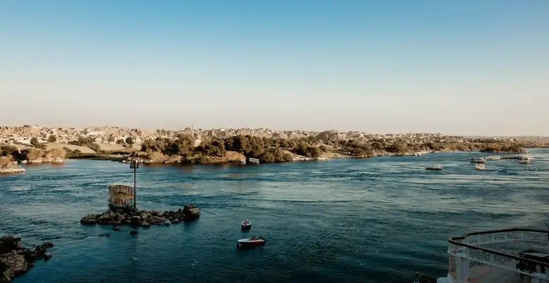 A magnificent luxury Nile cruise ship sailing along the tranquil waters of Egypt, operated by The Holiday Escape.