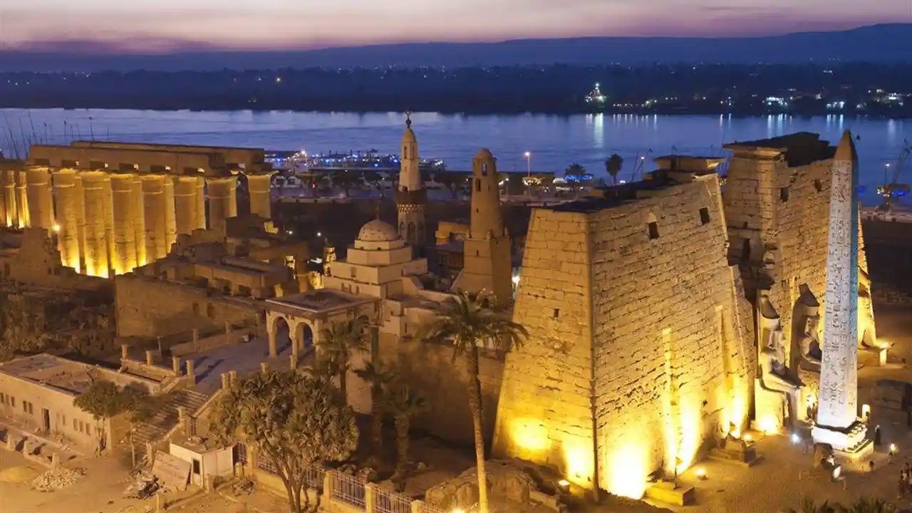 Luxor Temple illuminated at dusk during a Christmas holiday in Egypt